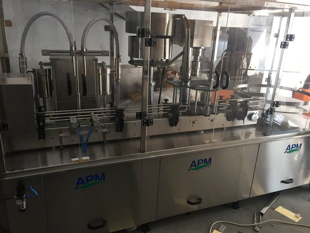 APM Mineral Water Glass Bottle Packaging Machine, Capacity: 40BPM