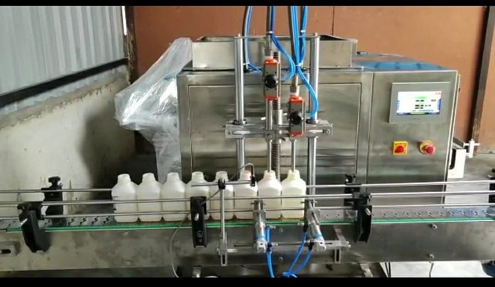 Automatic Twin Head Liquid Filling Machine